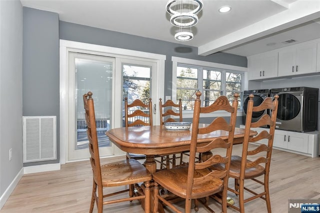 584 N Lake Shr, West Milford, NJ 07421 - dining area with independent washer and dryer, light wood-style floors, plenty of natural light, beamed ceiling, and a chandelier