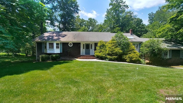 7 Anona Dr, Upper Saddle River, NJ 07458 - ranch-style home with a front lawn and a chimney