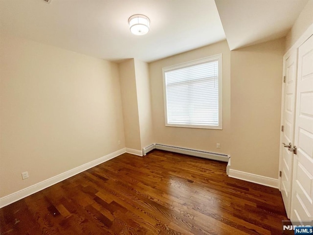 104 Sunset Pl Unit A, Palisades Park, NJ 07650 - unfurnished bedroom with a baseboard radiator and dark wood-type flooring