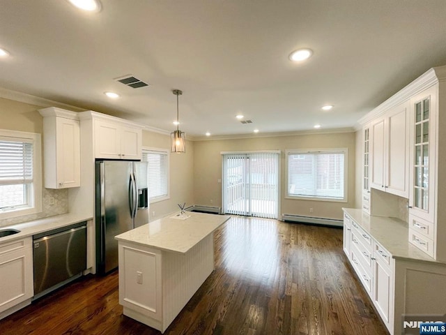 104 Sunset Pl Unit A, Palisades Park, NJ 07650 - kitchen featuring stainless steel appliances, a baseboard radiator, crown molding, glass insert cabinets, and white cabinets