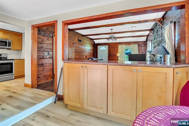 76 Hillside Rd, Sparta, NJ 07871 - kitchen featuring stainless steel appliances, light wood-type flooring, wooden walls, light brown cabinets, and beamed ceiling