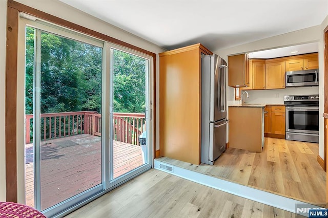 76 Hillside Rd, Sparta, NJ 07871 - kitchen with stainless steel appliances, light wood-type flooring, and plenty of natural light