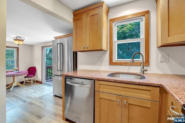 76 Hillside Rd, Sparta, NJ 07871 - kitchen featuring appliances with stainless steel finishes, light wood-type flooring, and light stone counters