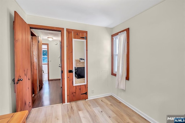 76 Hillside Rd, Sparta, NJ 07871 - unfurnished bedroom with light wood finished floors and multiple windows