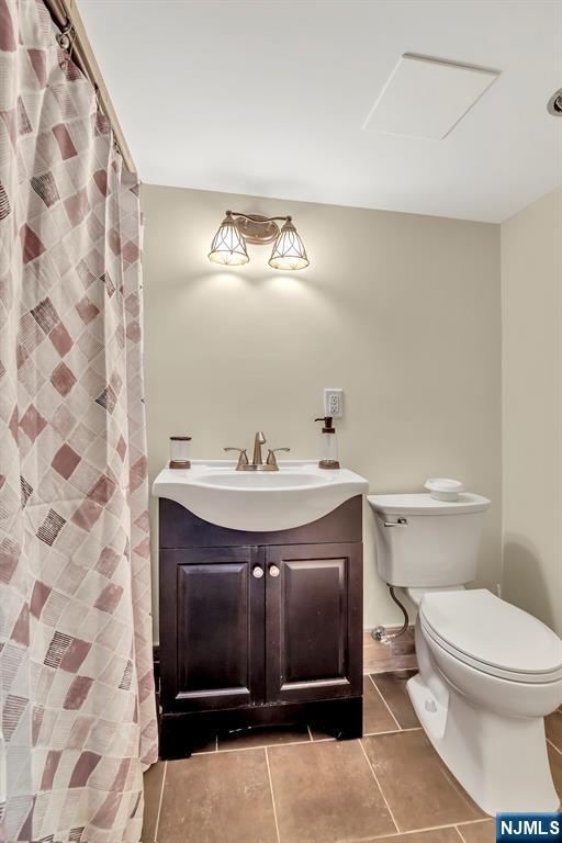76 Hillside Rd, Sparta, NJ 07871 - bathroom with tile patterned flooring and vanity