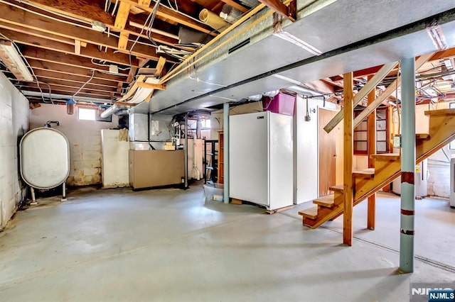 76 Hillside Rd, Sparta, NJ 07871 - below grade area featuring stairway, heating unit, and oil tank