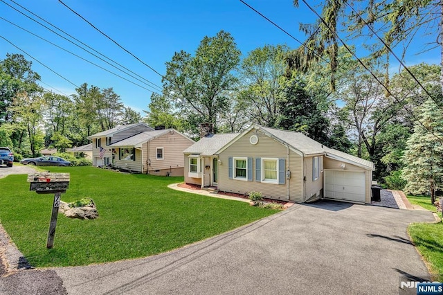 76 Hillside Rd, Sparta, NJ 07871 - view of front of property featuring asphalt driveway, an attached garage, a front yard, and entry steps