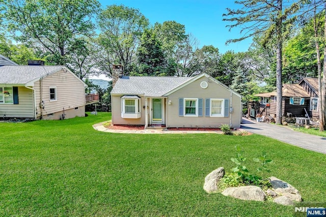 76 Hillside Rd, Sparta, NJ 07871 - view of front of house featuring a chimney, a front yard, crawl space, and driveway