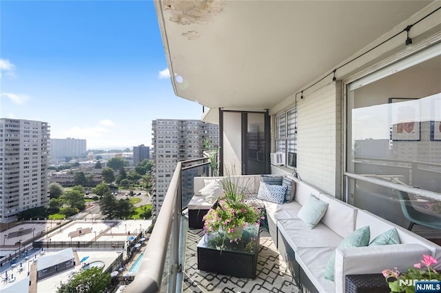 2077 Center Ave Unit 19C, Fort Lee, NJ 07024 - balcony with an outdoor living space and a city view