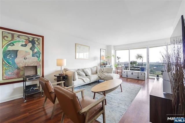 2077 Center Ave Unit 19C, Fort Lee, NJ 07024 - living room with wood finished floors and baseboards