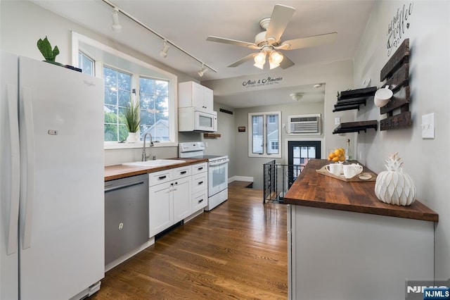5 Rhinesmith Ave, Wanaque, NJ 07465 - kitchen featuring white appliances, wooden counters, rail lighting, and white cabinetry