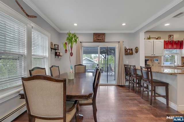 18 Gillies St, Clifton, NJ 07013 - dining area with baseboard heating, healthy amount of natural light, dark wood finished floors, crown molding, and recessed lighting