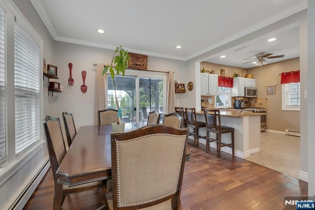 18 Gillies St, Clifton, NJ 07013 - dining area featuring a baseboard heating unit, wood finished floors, recessed lighting, ceiling fan, and ornamental molding