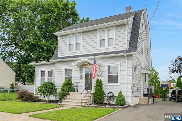 18 Gillies St, Clifton, NJ 07013 - dutch colonial featuring a shingled roof, a chimney, and a gambrel roof