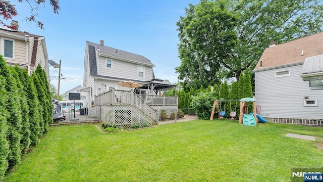 18 Gillies St, Clifton, NJ 07013 - back of property with a gazebo, a playground, a deck, and a fenced backyard