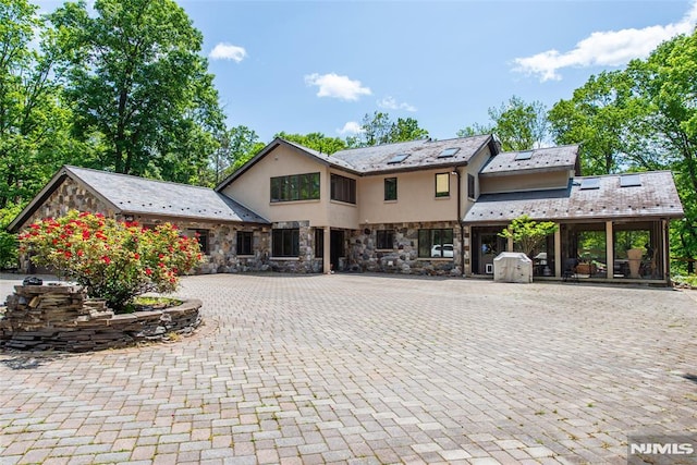 69 Mount Pleasant Rd, Knowlton, NJ 07832 - view of front of home with stone siding, stucco siding, curved driveway, and a high end roof