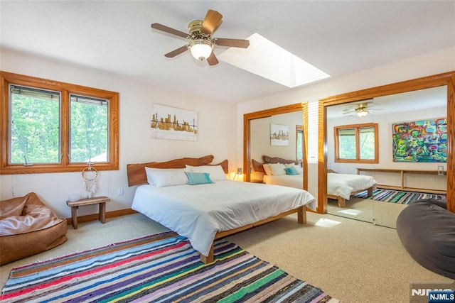 69 Mount Pleasant Rd, Knowlton, NJ 07832 - carpeted bedroom featuring a skylight, two closets, and ceiling fan