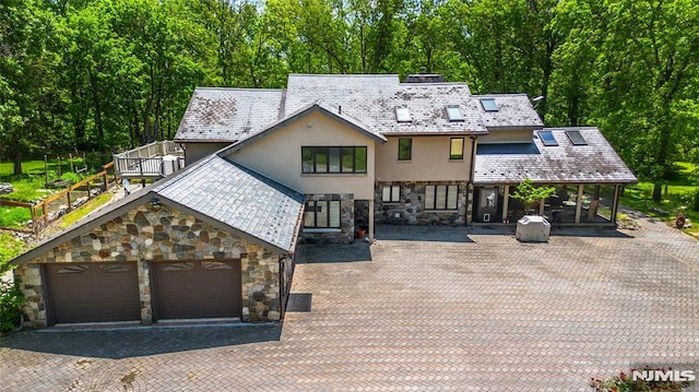 69 Mount Pleasant Rd, Knowlton, NJ 07832 - view of front of house with stone siding, stucco siding, a high end roof, and driveway