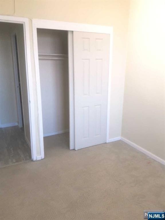 285 Aycrigg Ave Unit 22D, Passaic, NJ 07055 - unfurnished bedroom with carpet floors and a closet