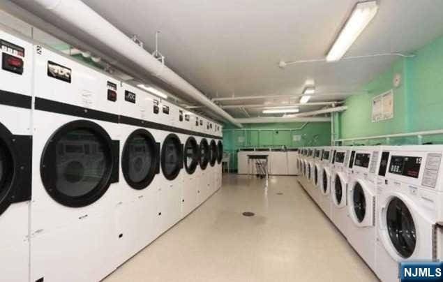 285 Aycrigg Ave Unit 22D, Passaic, NJ 07055 - shared laundry featuring washer and clothes dryer