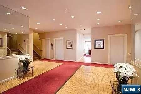 285 Aycrigg Ave Unit 22D, Passaic, NJ 07055 - common area with recessed lighting and stairway