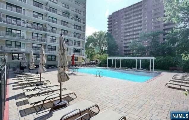 285 Aycrigg Ave Unit 22D, Passaic, NJ 07055 - community pool with a patio