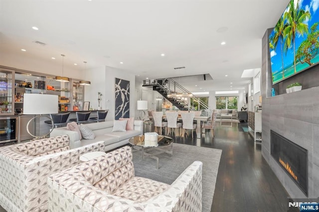 12 Hooks Ln, Edgewater, NJ 07020 - living room featuring wine cooler, wood finished floors, recessed lighting, and a glass covered fireplace