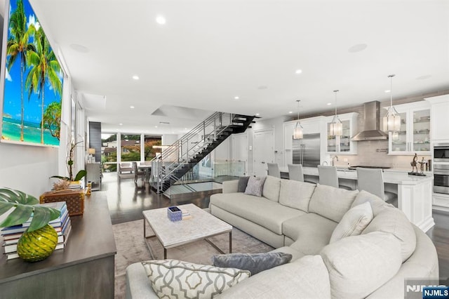 12 Hooks Ln, Edgewater, NJ 07020 - living area with wood finished floors, recessed lighting, and stairway