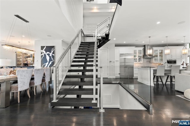 12 Hooks Ln, Edgewater, NJ 07020 - stairs featuring recessed lighting and wood finished floors