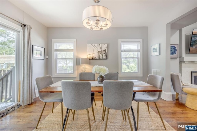 20 Brighton Ave, Bloomfield, NJ 07003 - dining area with wood finished floors and a chandelier