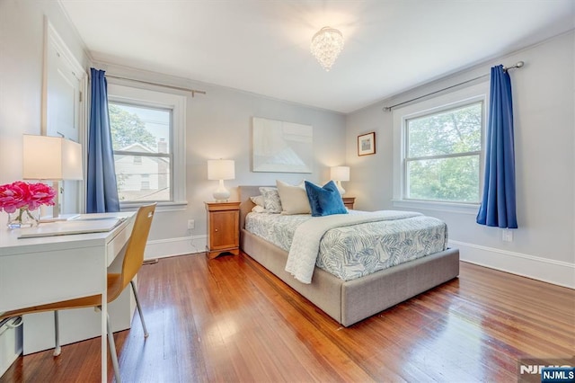 20 Brighton Ave, Bloomfield, NJ 07003 - bedroom featuring multiple windows and wood finished floors