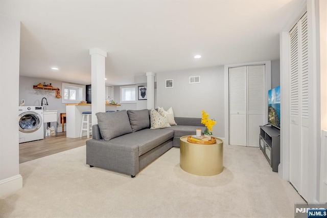 20 Brighton Ave, Bloomfield, NJ 07003 - living room featuring washer / dryer, light colored carpet, and recessed lighting