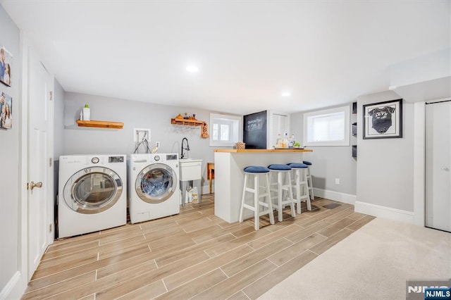 20 Brighton Ave, Bloomfield, NJ 07003 - laundry area with washing machine and dryer, light wood-style floors, a dry bar, and recessed lighting