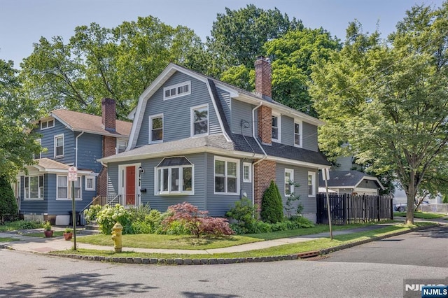 20 Brighton Ave, Bloomfield, NJ 07003 - colonial inspired home featuring a gambrel roof, a chimney, and roof with shingles