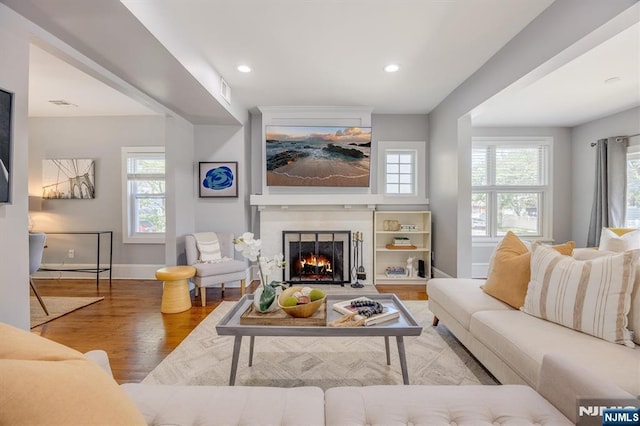 20 Brighton Ave, Bloomfield, NJ 07003 - living area with wood finished floors, healthy amount of natural light, a fireplace, and recessed lighting