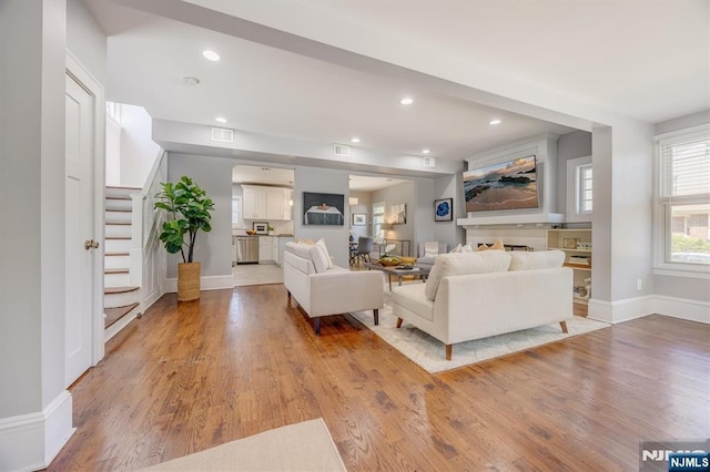 20 Brighton Ave, Bloomfield, NJ 07003 - living room featuring light wood-style flooring, stairs, and recessed lighting
