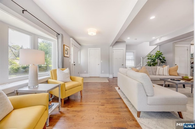 20 Brighton Ave, Bloomfield, NJ 07003 - living room featuring light wood-style flooring, plenty of natural light, recessed lighting, and stairs