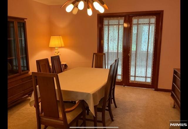 67 Melody Hill Rd, Clifton, NJ 07013 - dining area with light colored carpet, healthy amount of natural light, and ceiling fan