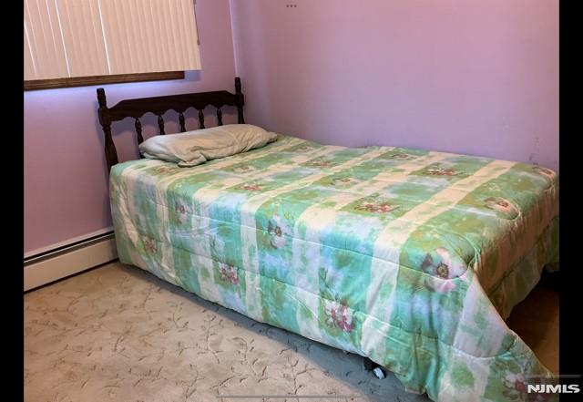 67 Melody Hill Rd, Clifton, NJ 07013 - bedroom featuring baseboard heating