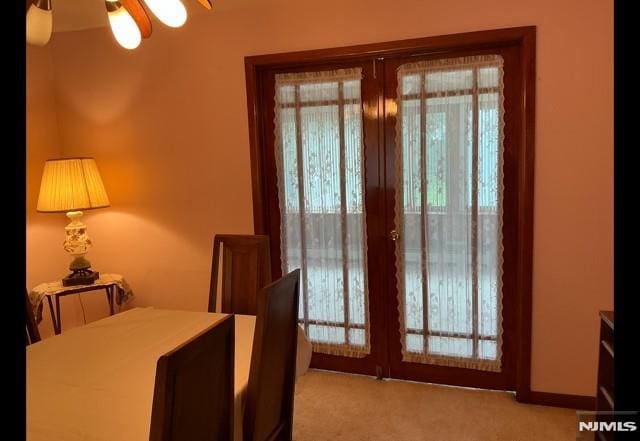 67 Melody Hill Rd, Clifton, NJ 07013 - dining space with carpet floors, french doors, and a ceiling fan