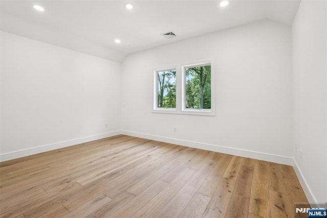 492 Oaktree Rd, Oradell, NJ 07649 - spare room with lofted ceiling, light wood-style floors, and recessed lighting
