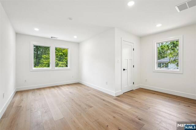 492 Oaktree Rd, Oradell, NJ 07649 - unfurnished room with healthy amount of natural light, light wood-style flooring, and recessed lighting