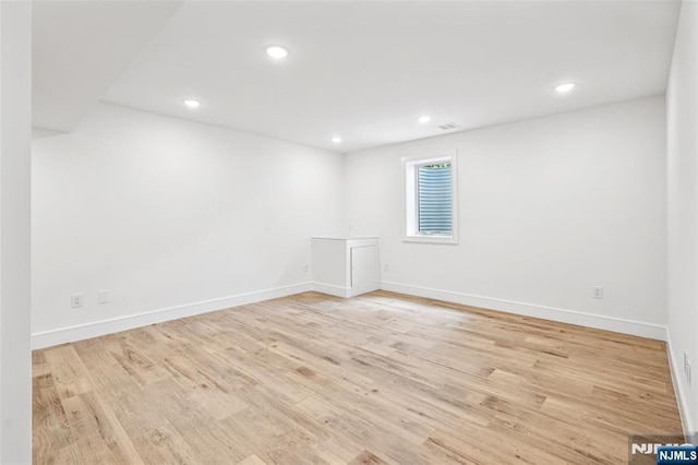 492 Oaktree Rd, Oradell, NJ 07649 - spare room with light wood finished floors and recessed lighting