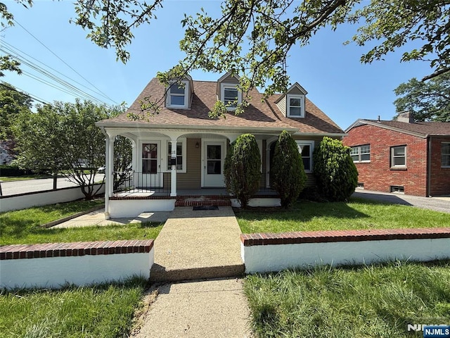 28 Willow St, Elmwood Park, NJ 07407 - cape cod house with a porch, a front lawn, and roof with shingles