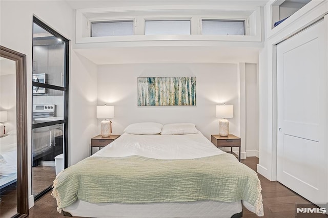 6401 Park Ave Unit 401, West New York, NJ 07093 - bedroom featuring dark wood-type flooring and a closet