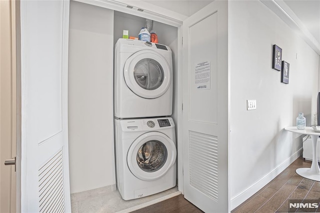 6401 Park Ave Unit 401, West New York, NJ 07093 - laundry room featuring stacked washer / dryer and wood finished floors