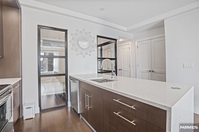 6401 Park Ave Unit 401, West New York, NJ 07093 - kitchen with stainless steel appliances, dark brown cabinetry, dark wood-style floors, modern cabinets, and an island with sink