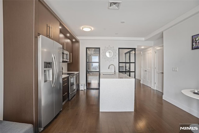 6401 Park Ave Unit 401, West New York, NJ 07093 - kitchen featuring stainless steel appliances, light countertops, modern cabinets, and dark wood finished floors