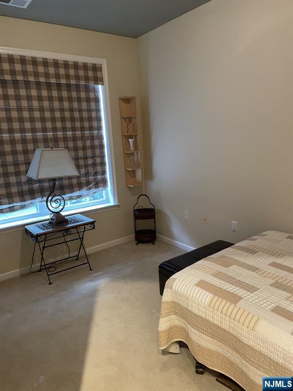 5 Cliff Rd Unit C1, Woodland Park, NJ 07424 - carpeted bedroom featuring baseboards
