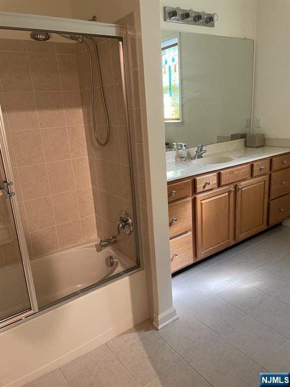 5 Cliff Rd Unit C1, Woodland Park, NJ 07424 - bathroom featuring tile patterned flooring, vanity, and enclosed tub / shower combo